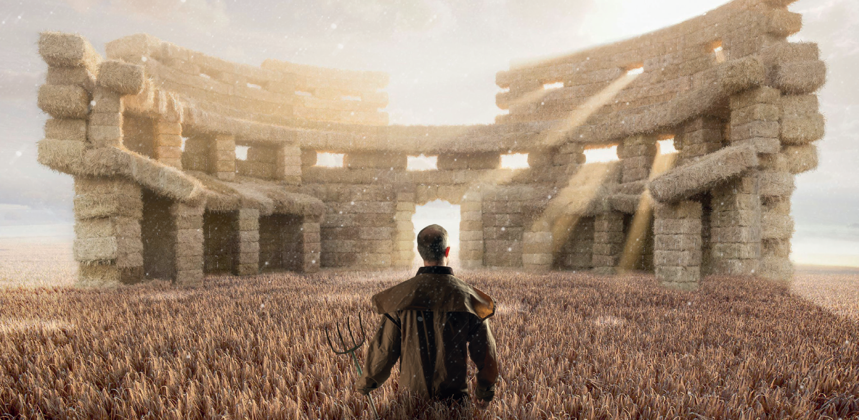 A farmer with a pitchfork stands in a wheat field before a colosseum‑like structure made of hay bales, lit by sunbeams.