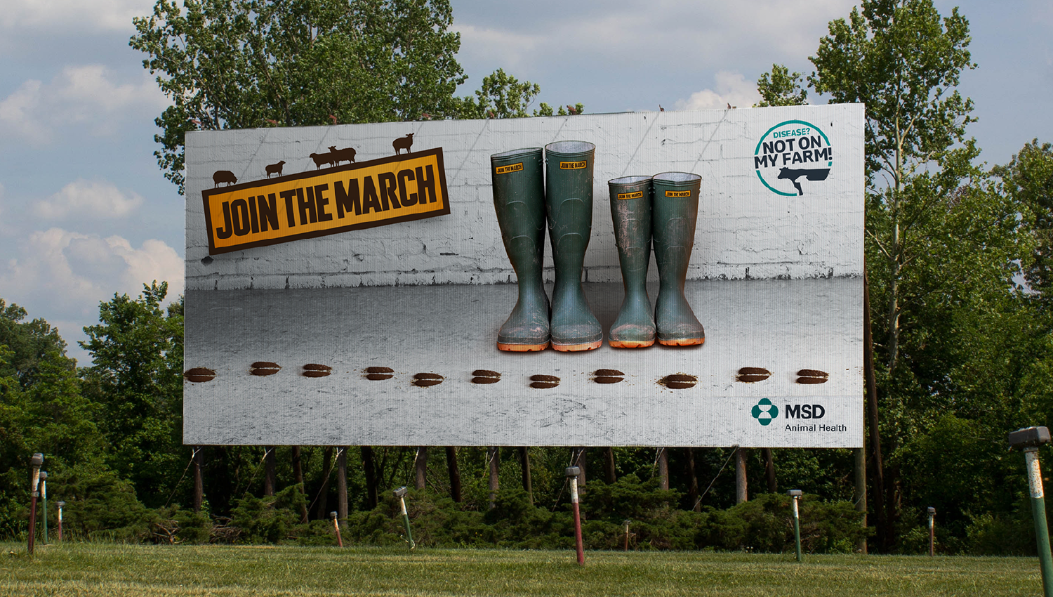 Billboard with rubber boots and the message ‘Join the march’ promoting animal health.