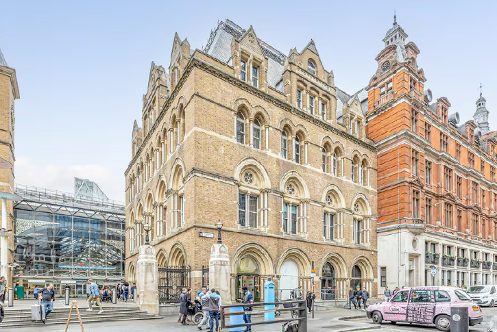 Exterior view of historic brick buildings beside Liverpool Street Station in London, showing the Mobas office at 50 Liverpool Street.