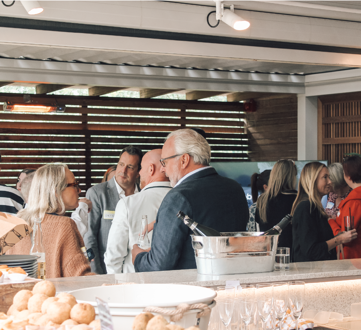 People socialising at a networking event.