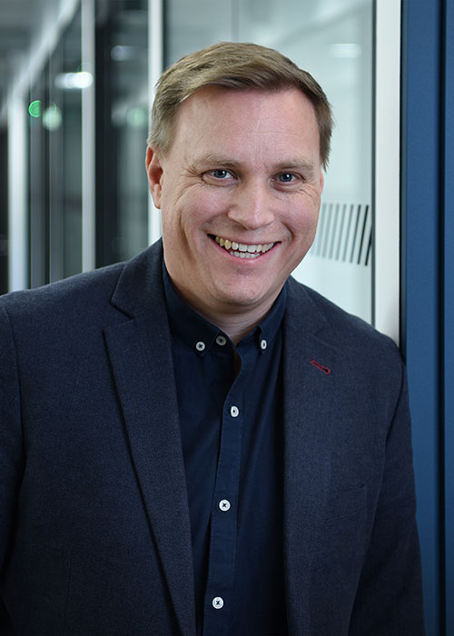 Headshot photo of Adam Tuckwell.