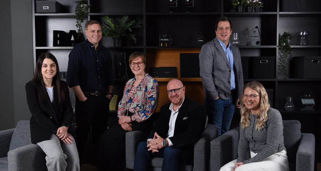 Group shot of the Mobas Senior Leadership Team taken within the office location.