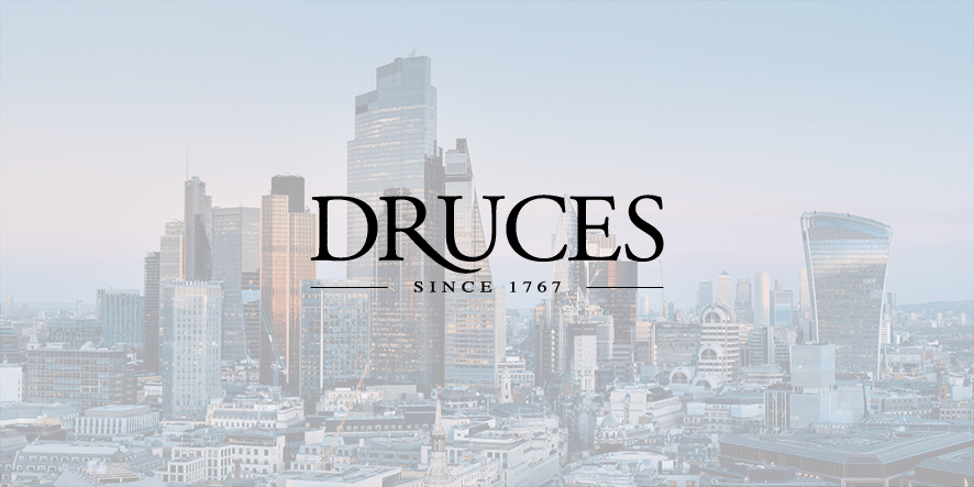 Druces Logo over a washed out London city landscape.