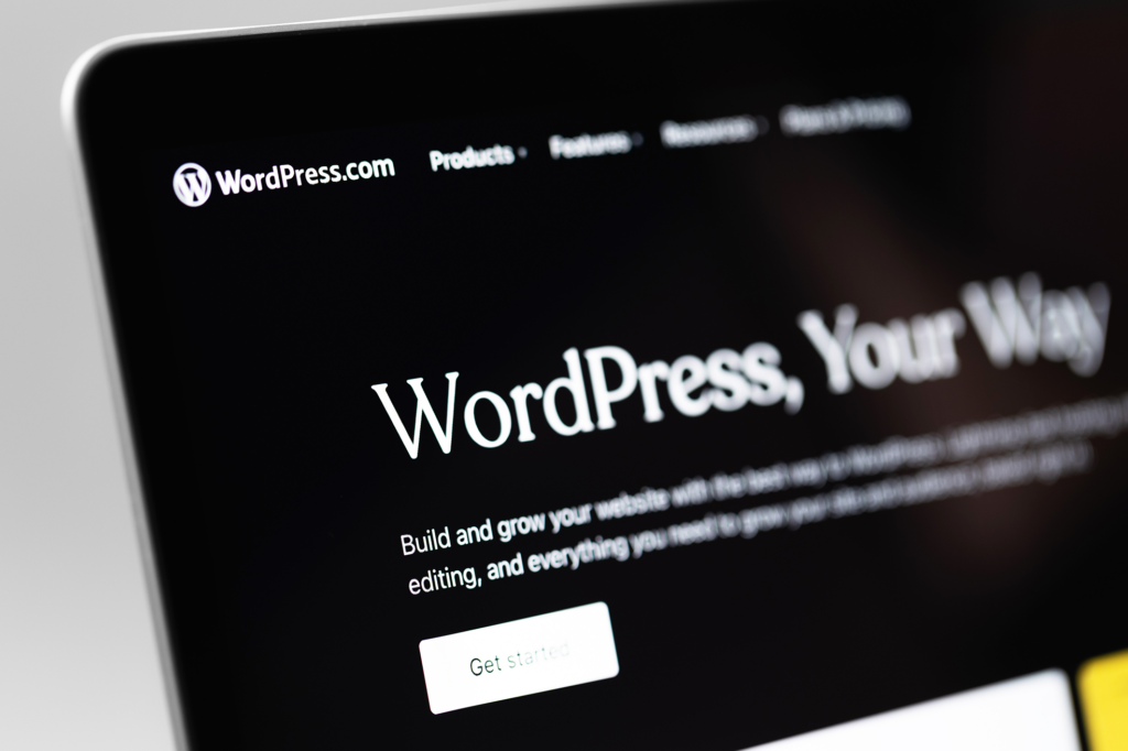 The corner of a laptop screen with the website for WordPress.